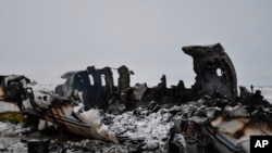 A wreckage of a U.S. military aircraft that crashed in Ghazni province, Afghanistan, is seen Monday, Jan. 27, 2020. 