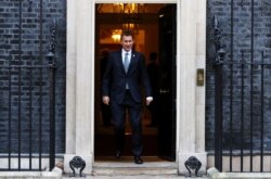 FILE - Britain's Foreign Secretary Jeremy Hunt leaves 10 Downing Street, London, Britain, Nov. 13, 2018.