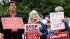 FILE - Opponents of the academic doctrine known as critical race theory protest outside of the Loudoun County School Board headquarters, in Ashburn, Virginia, June 22, 2021.