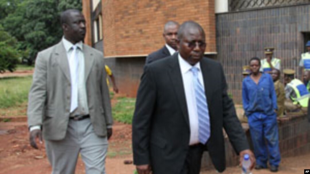 Elton Mangoma, centre, Zimbabwe's Minster of Energy and Power Development outside the magistrates courts (AP Photo/Tsvangirayi Mukwazhi)