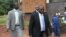 Elton Mangoma, centre, Zimbabwe's Minster of Energy and Power Development outside the magistrates courts. (AP Photo/Tsvangirayi Mukwazhi)
