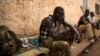 FILE - A man reacts in the RDOT camp in Kilometre 11 (PK11), where some of the last remaining ex-Seleka fighters are sheltering, guarded by African Union and French peacekeeping forces in the capital Bangui, March 14, 2014. 