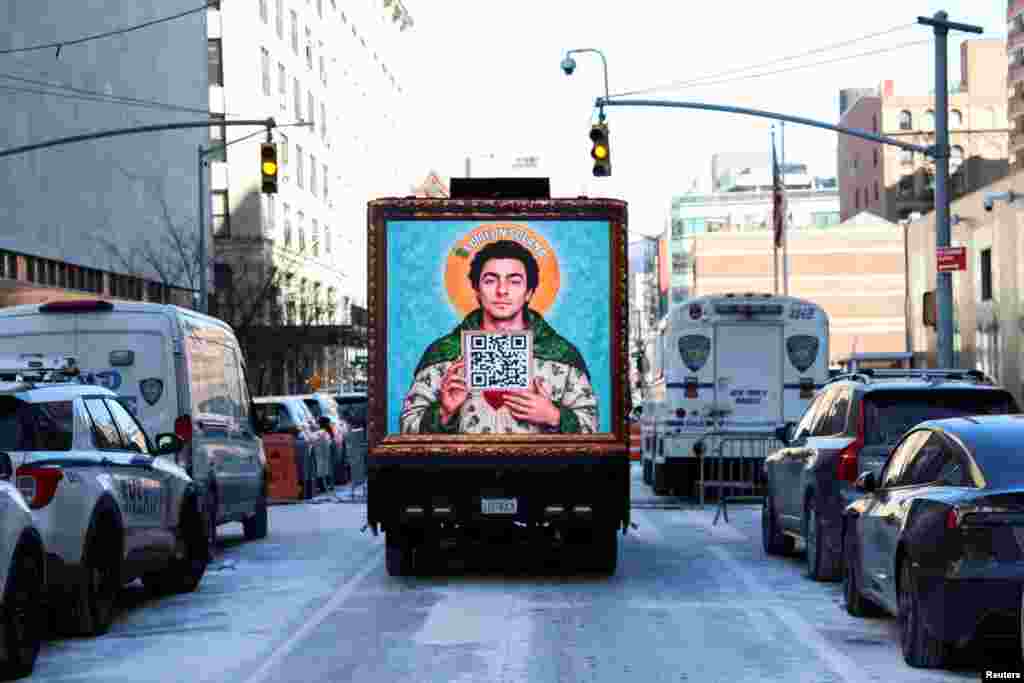 An image depicting Luigi Mangione, the suspect in the killing of UnitedHealth Group chief executive Brian Thompson, is shown on a vehicle on the day Mangione is expected to attend a hearing murder and terrorism charges in New York City.