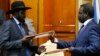 South Sudan's President Salva Kiir (L) and the country's rebel leader, Riek Machar, last met only briefly on May 9 to exchange a document recommitting to a peace agreement they agreed to months earlier but which was repeatedly violated.