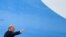 President Donald Trump waves from the top of the steps of Air Force One at Andrews Air Force Base in Maryland, July 10, 2020. 