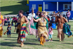 St. David's Islanders JeanAnn Hall, DaVeene Hollis-Burchall and Susanne Holshouser dance at the Bermuda Pow Wow, June 25, 2015.