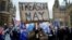 FILE - A pro-Brexit protester holds a banner as anti-Brexit protesters demonstrate outside the Houses of Parliament, ahead of a vote on Prime Minister Theresa May's Brexit deal, in London, Britain, January 15, 2019. 