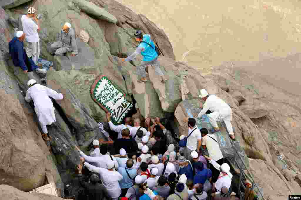 Muslim pilgrims visit the Hera cave, where Prophet Mohammad was believed to receive the first words of the Quran through Gabriel, at the top of Mount Al-Noor, ahead of the annual haj pilgrimage in the holy city of Mecca, Saudi Arabia, Sept. 7, 2016. .