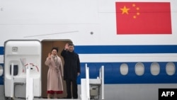 Chinese President Xi Jinping and his wife, Peng Liyuan, wave before their departure, at the Tarbes-Lourdes airport, France, on May 7, 2024.