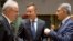 Hungarian Foreign Minister Peter Szijjarto, center, speaks with Malta's Foreign Minister Carmelo Abela, right, and European Commissioner for International Cooperation Neven Mimica during a meeting of EU foreign ministers at the Europa building in Brussels, Belgium, May 28, 2018. EU foreign ministers were seeking to protect the bloc's strategic and economic interests in Iran.