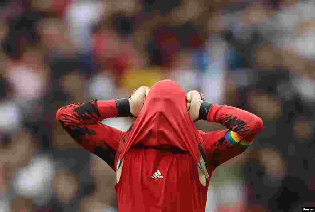 Germany&#39;s Manuel Neuer reacts after England&#39;s Raheem Sterling scored their first goal during the Euro 2020 soccer match round of 16 at Wembley Stadium, London, Britain.