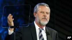 FILE - In this Nov. 28, 2018, photo, Jerry Falwell Jr. speaks before a convocation at Liberty University in Lynchburg, Va. 