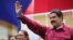 Venezuela's President Nicolas Maduro waves as he arrives for a rally with supporters in Caracas, Venezuela, Nov. 7, 2017. 