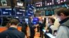 In this photo provided by the New York Stock Exchange, traders work on the floor, Apr. 21, 2021. (Courtney Crow/New York Stock Exchange via AP)