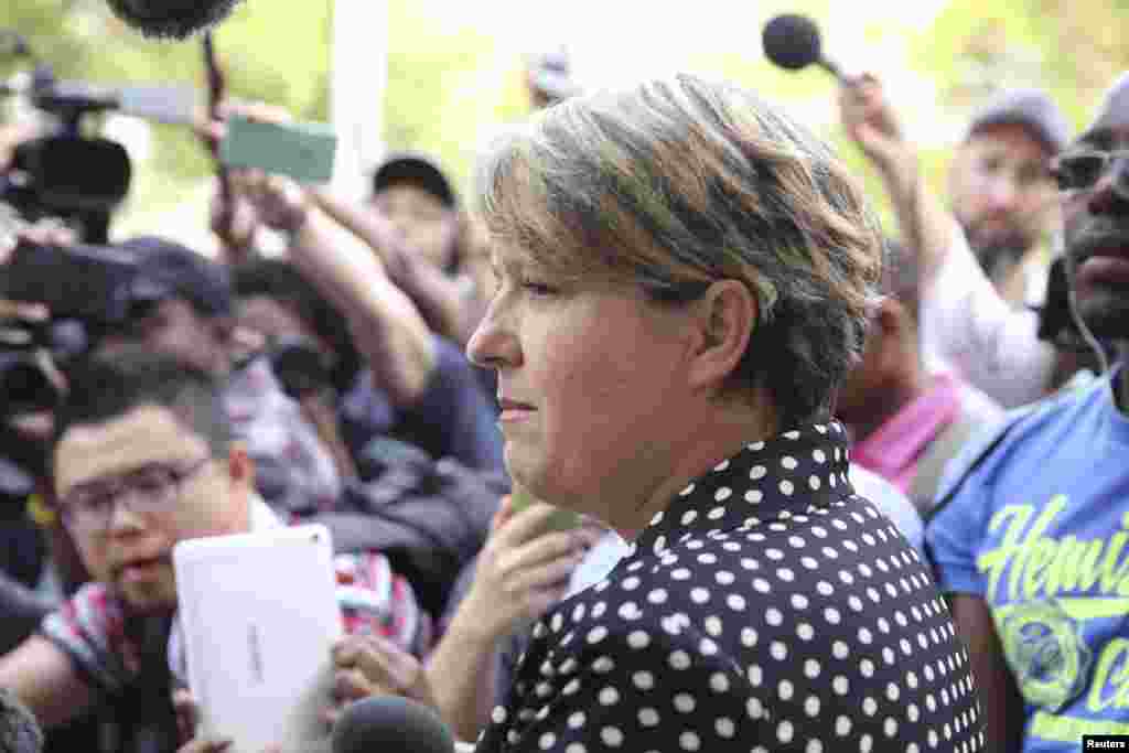Anneliese Burgess, spokesperson for the family of South African Olympic and Paralympic sprinter Oscar Pistorius, reads a short statement, Pretoria, Oct. 20, 2015.