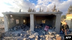 A man inspects the damage at the site of an Israeli airstrike that targeted the village of Makneh in eastern Lebanon, Nov. 21, 2024, amid the war between Israel and Hezbollah.