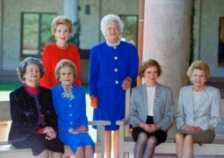 A portrait of former first ladies: Nancy Reagan and Barbara Bush (standing). Seated, left to right: Lady Bird Johnson, Pat Nixon, Rosalynn Carter and Betty Ford, Nov. 4, 1991 in Simi Valley, California.