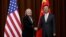 U.S. Secretary of State Hillary Rodham Clinton, left, and Chinese Foreign Minister Yang Jiechi, right, shake hands during her visit to Beijing, Sept. 4, 2012. 