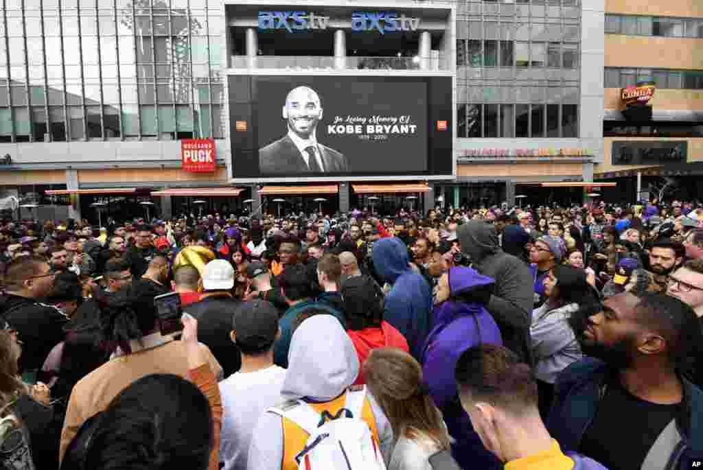 People gather outside Staples Center after the death of Laker legend Kobe Bryant, Jan. 26, 2020, in Los Angeles. 