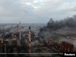 A view shows smoke rising at Azovstal Iron and Steel Works in Mariupol