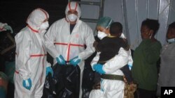 This handout picture released on Aug.18, 2014 by the Italian Navy press office, Marina Militare, shows migrants aboard a boat after being rescued overnight by the Italian Navy as part of the "Mare Nostrum" operation.