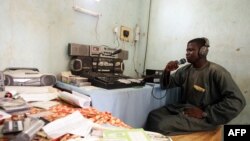 FILE - A man works in a village radio station in Maradi, Niger. Local broadcasters are increasingly coming under attack in parts of the Sahel.