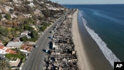 FILE - An aerial view shows the devastation from the Palisades Fire on beachfront homes in Malibu, California, Jan. 15, 2025.