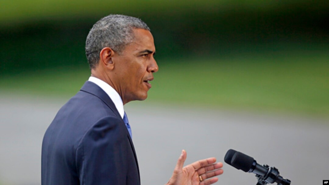 President Barack Obama talks about his administration's response to a growing insurgency foothold in Iraq, June 13, 2014, on the South Lawn of the White House.