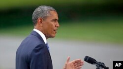 President Barack Obama talks about his administration's response to a growing insurgency foothold in Iraq, June 13, 2014, on the South Lawn of the White House.