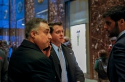 In this Dec. 12, 2016 photo, Los Angeles venture capitalist Imaad Zuberi, far left, arrives at Trump Tower in New York.