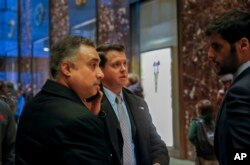 In this Dec. 12, 2016 photo, Los Angeles venture capitalist Imaad Zuberi, far left, arrives at Trump Tower in New York.