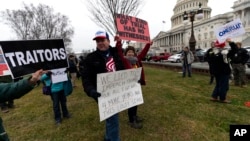 Activists gather on the East Front of the Capitol after the impeachment acquittal of President Donald Trump, on Capitol Hill, Feb. 5, 2020 in Washington.