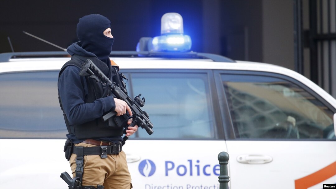 FILE - A Belgian special forces police officer stands guard outside a courthouse as Paris attacks suspect Salah Abdelslam remains in police custody, in Brussels, Belgium, April 7, 2016. 