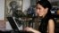 Cuban dissident blogger Yoani Sanchez works on her laptop at her home in Havana, February 9, 2011. 