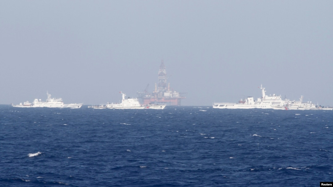 FILE - Chinese oil rig Haiyang Shi You 981 is seen surrounded by ships of China Coast Guard in the South China Sea, about 210 km (130 miles) off shore of Vietnam.
