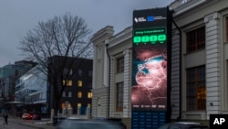 A screen near the Energy Museum and Mindaugas Bridge indicates that on Feb. 8 the Baltic States is disconnecting from the Russian electricity grid to synchronize with Continental Europe, in Vilnius, Feb. 4, 2025.