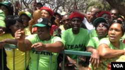 FILE: Zanu-PF supporters outside parliament during the official opening ceremony