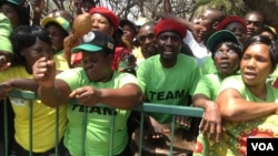Zanu-PF supporters outside parliament during the official opening ceremony Tuesday
