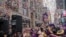 People watch confetti as it's thrown from the Hard Rock Cafe marquee as part of the annual confetti test ahead of the New Year's Eve ball-drop celebrations in Times Square in New York City, New York, U.S., December 29, 2019. 