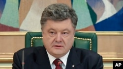 FILE - Ukraine President Petro Poroshenko, shown speaking to officials in his office in April, has said he considers all of Ukraine’s high-ranking officials to be potential targets of the National Agency for the Prevention of Corruption.