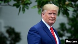 FILE PHOTO: U.S. President Donald Trump arrives for a photo opportunity with sheriffs from across the country on the South Lawn of the White House in Washington, Sept. 26, 2019.