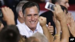 Republican presidential candidate Mitt Romney greets supporters after speaking at a rally in Las Vegas, September 21, 2012.