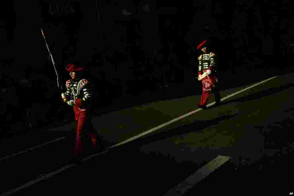 &quot;Tamborilleros,&quot; wearing their uniforms, march in the traditional &#39; La Tamborrada,&#39; during &#39;El Dia Grande,&#39; the main day of San Sebastian feasts, in the Basque city of San Sebastian, northern Spain.