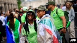 FILE—People queue in the street outside the South African High Commission in central London on May 18, 2024, to vote in South Africa's forthcoming general election.