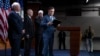 Speaker of the House Mike Johnson, center, joined by fellow lawmakers, leaves a news conference at the Capitol in Washington, Sept. 24, 2024. Legislators in both chambers of Congress have approved a short-term spending bill that will fund federal agencies for about three months.