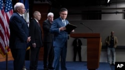 Speaker of the House Mike Johnson, center, joined by fellow lawmakers, leaves a news conference at the Capitol in Washington, Sept. 24, 2024. Legislators in both chambers of Congress have approved a short-term spending bill that will fund federal agencies for about three months.