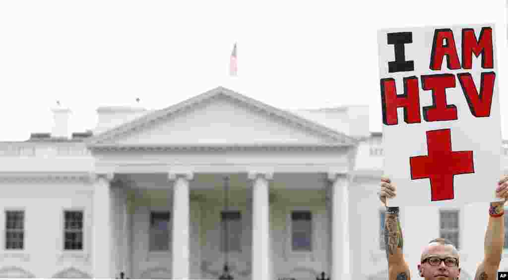 Aaron Laxton gathers in front of the White House in Washington during an AIDS demonstration, July 24, 2012, as the AIDS conference continues.