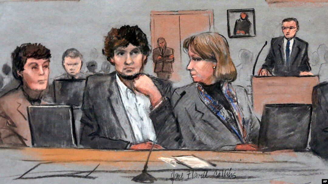FILE - In this courtroom sketch, Dzhokhar Tsarnaev, center, is depicted between defense attorneys Miriam Conrad, left, and Judy Clarke, right, during his federal death penalty trial.