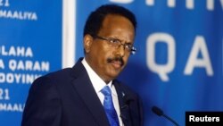 FILE - Somalia's President Mohamed Abdullahi Mohamed addresses delegates at the Somali election negotiation in Mogadishu, May 27, 2021.