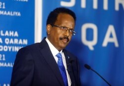 FILE - Somalia's President Mohamed Abdullahi Mohamed addresses delegates at the Somali election negotiation in Mogadishu, May 27, 2021.